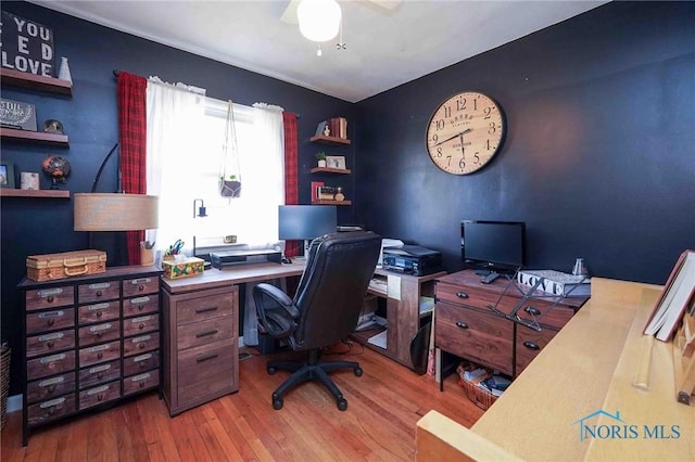 home office with hardwood / wood-style floors