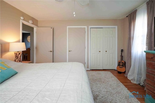 bedroom featuring a ceiling fan and wood finished floors