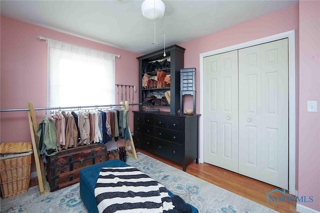 bedroom with a closet and wood finished floors