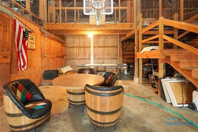 interior space with wooden walls and concrete flooring