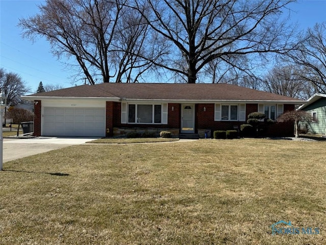 ranch-style house with a front yard, brick siding, concrete driveway, and an attached garage