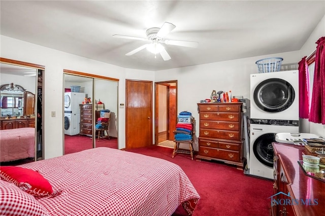 bedroom featuring two closets, a ceiling fan, dark colored carpet, and stacked washer and dryer