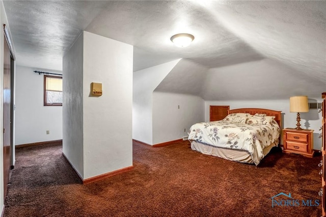 bedroom with baseboards, lofted ceiling, and carpet floors