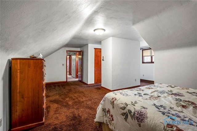 carpeted bedroom with baseboards, a textured ceiling, and lofted ceiling