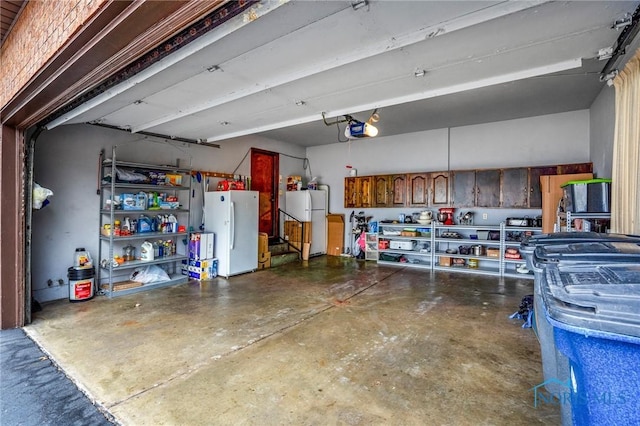 garage with a garage door opener and freestanding refrigerator