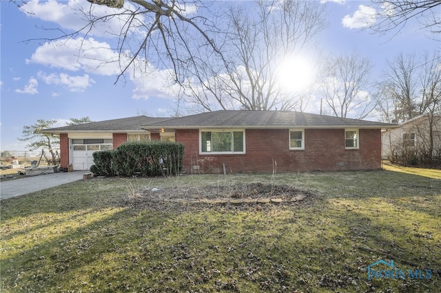 single story home with brick siding, concrete driveway, a front lawn, and a garage