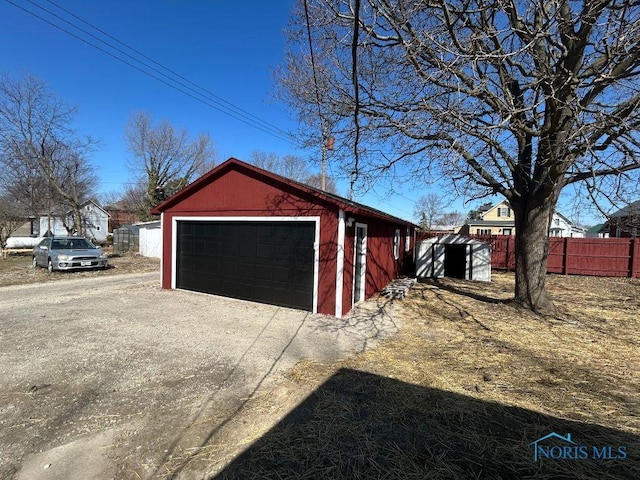 detached garage with fence