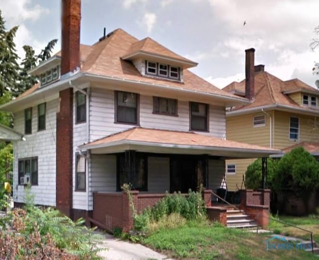 traditional style home featuring covered porch