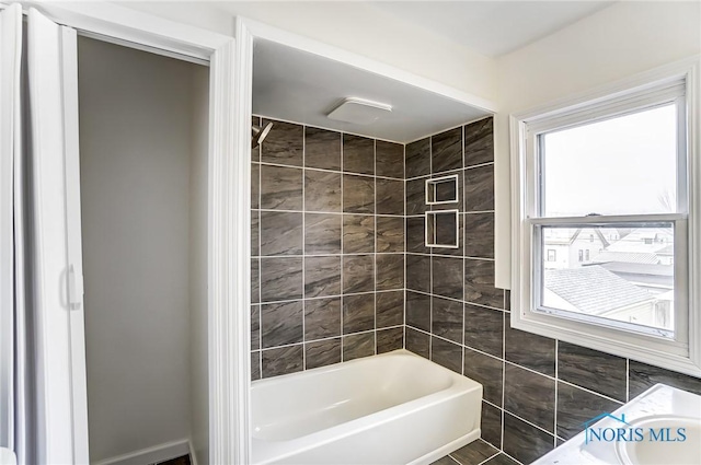 full bathroom with shower / bath combination and tile walls