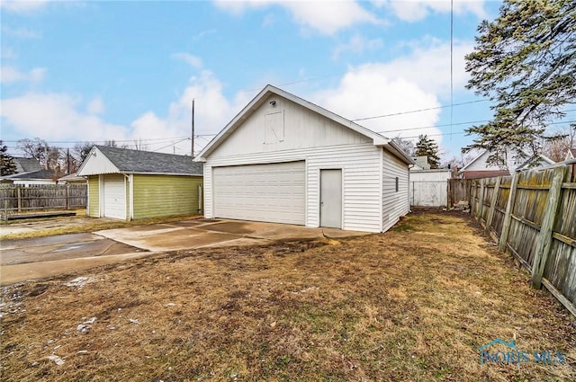 detached garage with fence