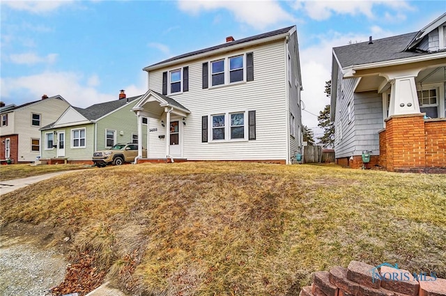 view of front of house featuring a residential view and a front lawn