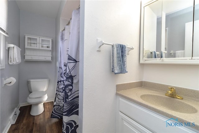 full bath featuring visible vents, baseboards, toilet, wood finished floors, and vanity