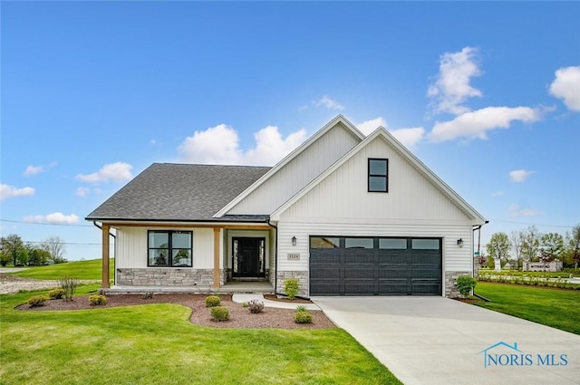 5224 Rail St, Monclova, OH 43542 - modern farmhouse with stone siding, driveway, a front lawn, and roof with shingles