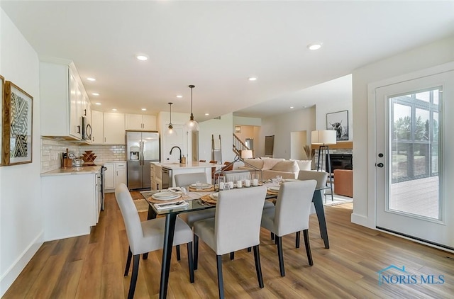 5224 Rail St, Monclova, OH 43542 - dining space with recessed lighting, baseboards, and wood finished floors