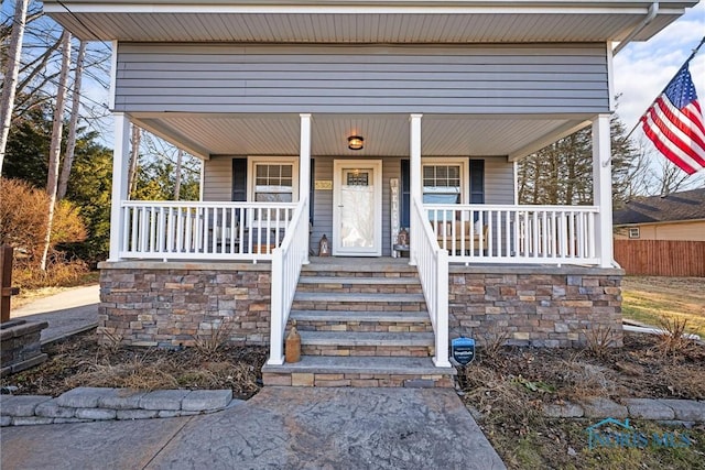 doorway to property with covered porch