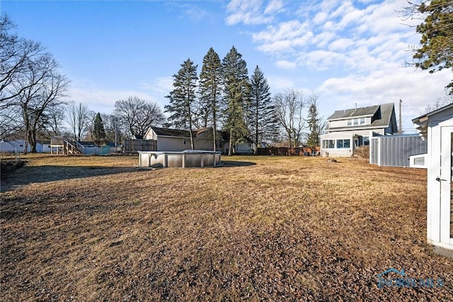 view of yard with an outdoor pool