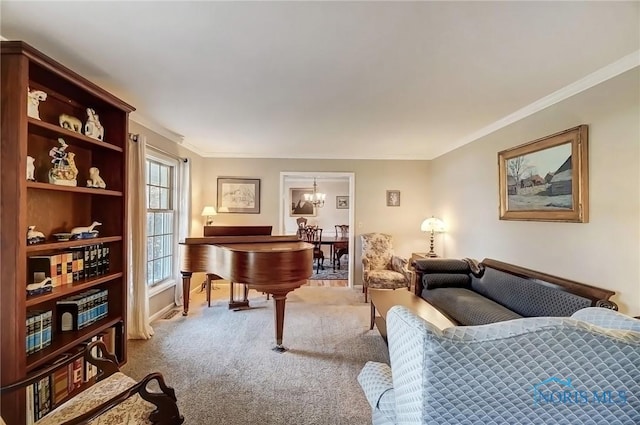 sitting room featuring ornamental molding, carpet, and a chandelier