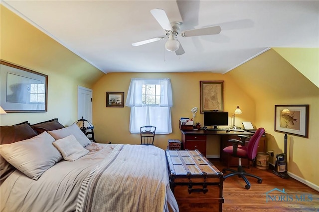 bedroom featuring vaulted ceiling, ceiling fan, baseboards, and wood finished floors