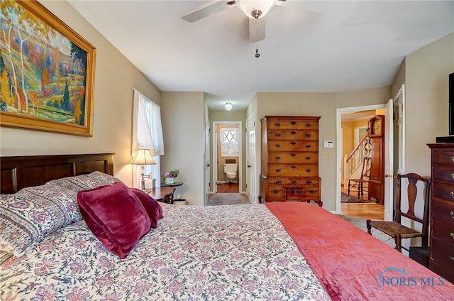 bedroom featuring ensuite bath and ceiling fan