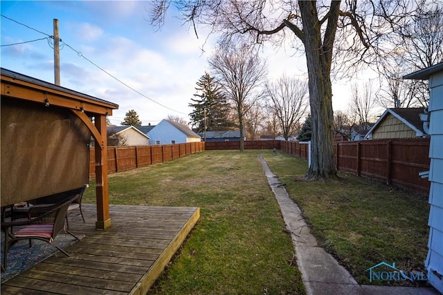 view of yard with a deck and a fenced backyard