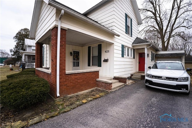 view of front of house featuring brick siding and entry steps