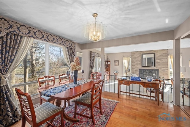 dining space featuring a chandelier and light wood-type flooring