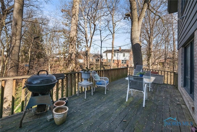 wooden terrace featuring grilling area