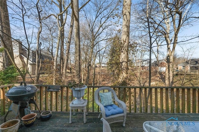 wooden deck with grilling area