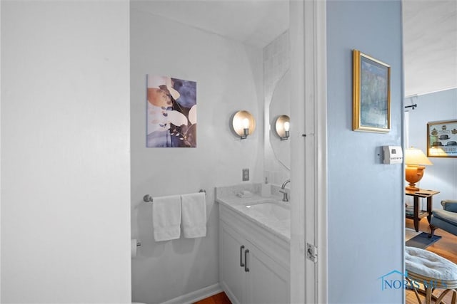 bathroom with vanity and ensuite bathroom