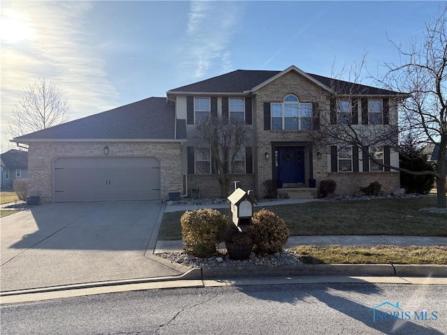 view of front of property featuring brick siding, concrete driveway, and a garage