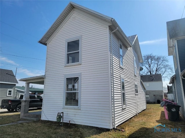 view of property exterior featuring a yard