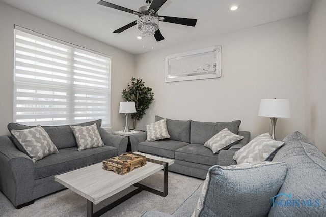 living area with recessed lighting and a ceiling fan