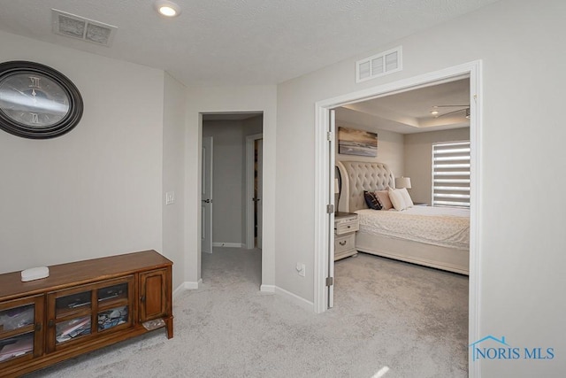 carpeted bedroom featuring recessed lighting, baseboards, visible vents, and a textured ceiling