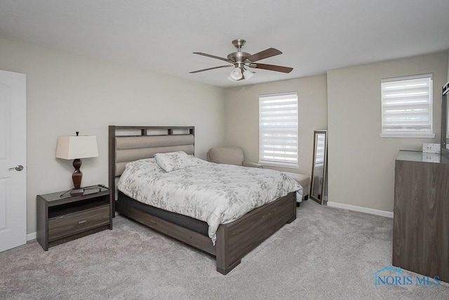 bedroom featuring a ceiling fan, baseboards, and carpet floors