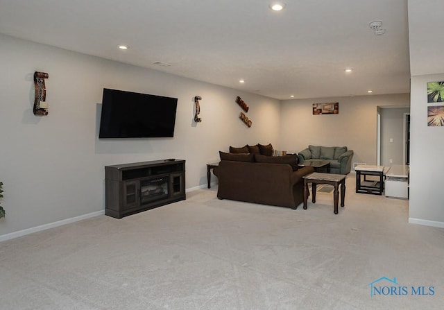 living area with carpet flooring, recessed lighting, and baseboards