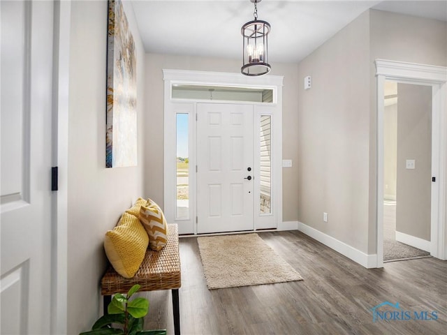 entrance foyer with wood finished floors and baseboards