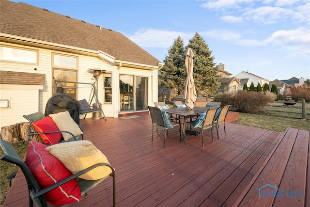 deck with outdoor dining area