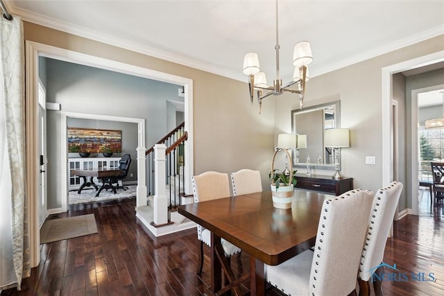 dining area featuring wood-type flooring, a notable chandelier, and ornamental molding