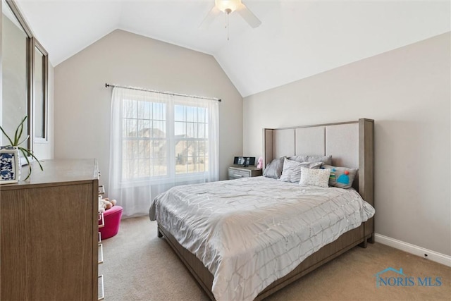 carpeted bedroom featuring ceiling fan, baseboards, and lofted ceiling