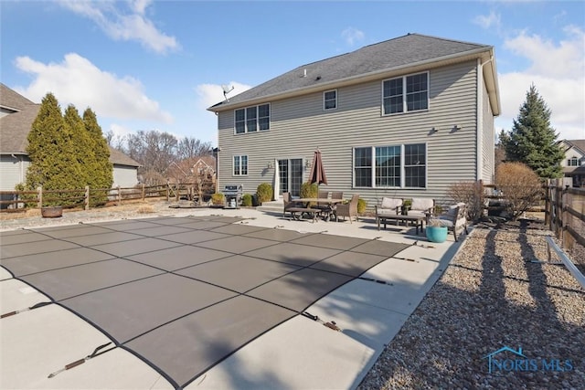 rear view of house with entry steps, a patio, a fenced backyard, and an outdoor hangout area