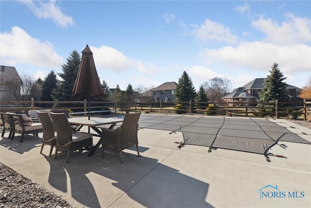 view of patio / terrace with outdoor dining space and fence