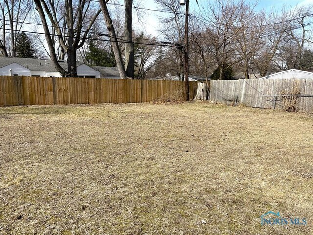 view of yard with fence