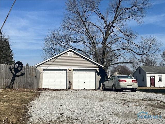 detached garage with fence