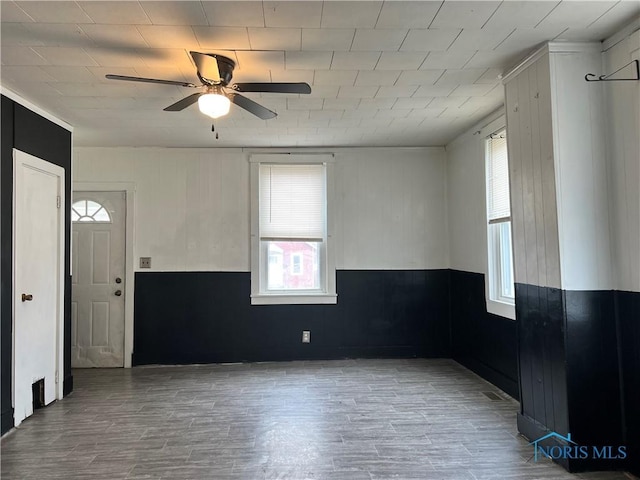 spare room featuring ceiling fan and wood finished floors