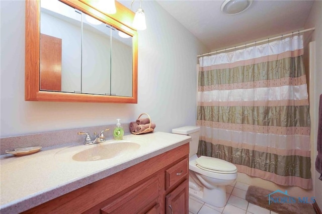 full bathroom featuring a shower with shower curtain, toilet, vanity, and tile patterned flooring