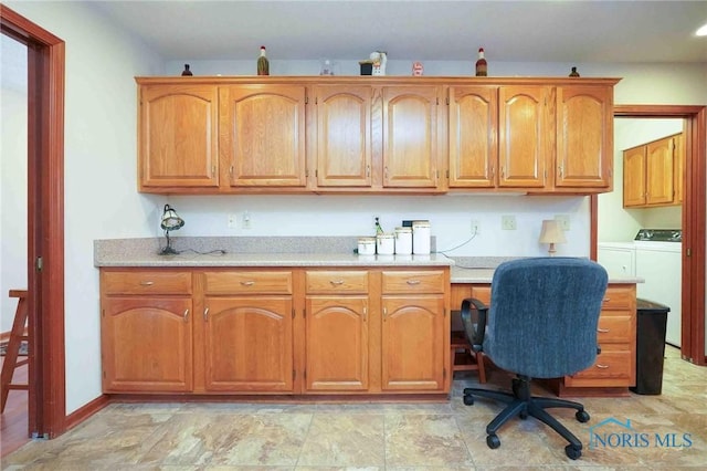 office space featuring washing machine and clothes dryer