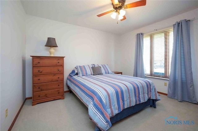 bedroom featuring ceiling fan, baseboards, and carpet floors