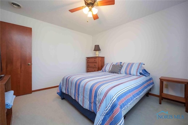 bedroom with visible vents, carpet flooring, baseboards, and a ceiling fan