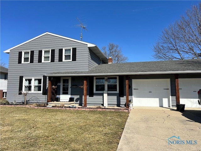 view of front of property with a front lawn, concrete driveway, a garage, and a chimney