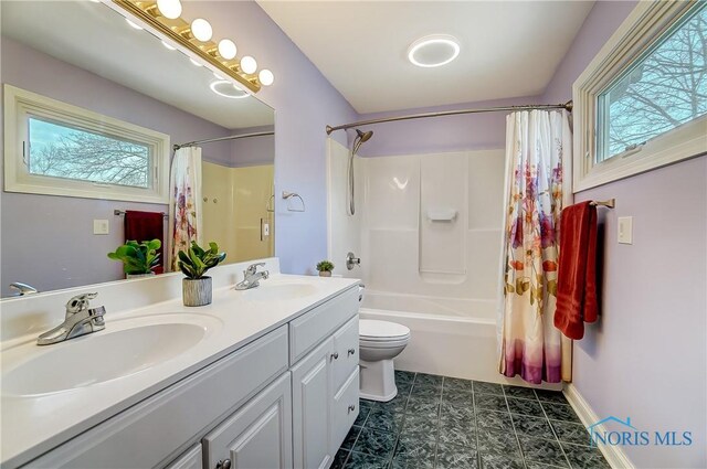 7221 Apache Trl, Holland, OH 43528 - full bath with toilet, shower / bathtub combination with curtain, and double vanity